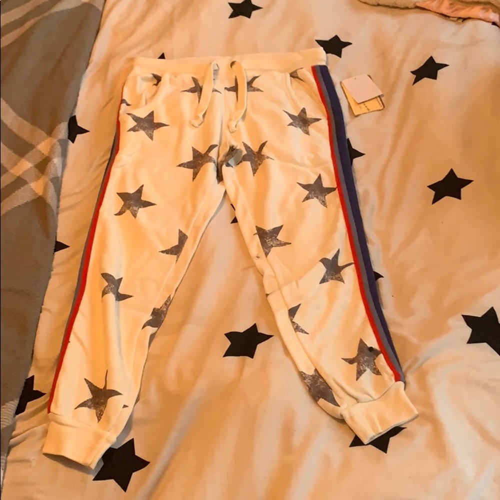 white joggers with stars and stripes down the side
